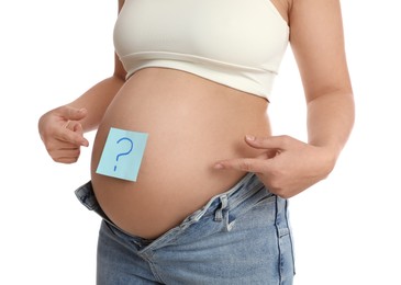 Pregnant woman with sticky note on belly against white background, closeup. Choosing baby name