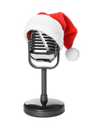 Retro microphone with Santa hat isolated on white. Christmas music