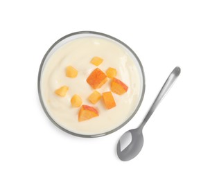 Delicious yogurt with fresh peach in glass bowl and spoon on white background, top view
