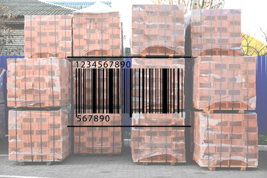 Barcode and pallets with red bricks in wholesale warehouse