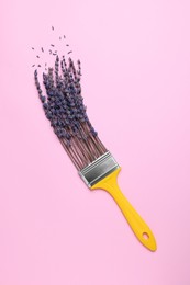 Photo of Creative flat lay composition with paint brush and lavender flowers on pink background