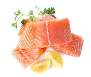 Fresh raw salmon with parsley and lemon on white background, top view. Fish delicacy