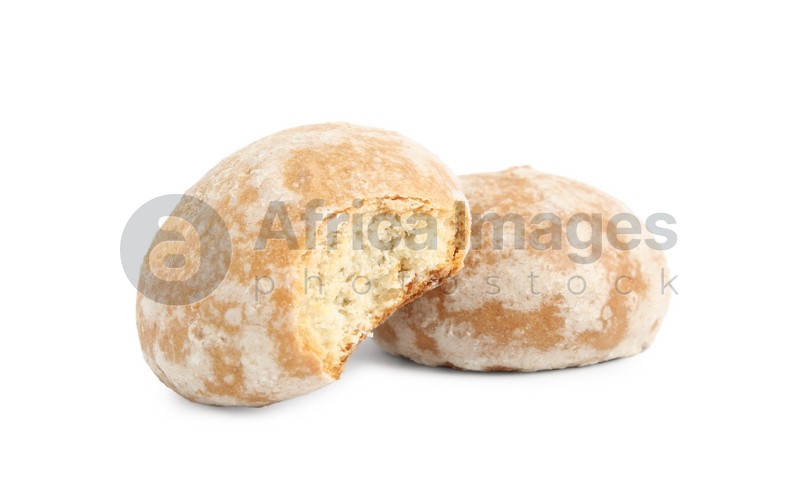 Photo of Tasty bitten and whole gingerbread cookies on white background