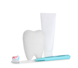 Tooth shaped holder, paste and brush on white background