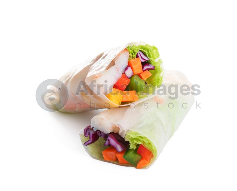 Delicious rolls wrapped in rice paper isolated on white