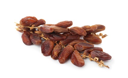 Sweet dates on branches against white background. Dried fruit as healthy snack