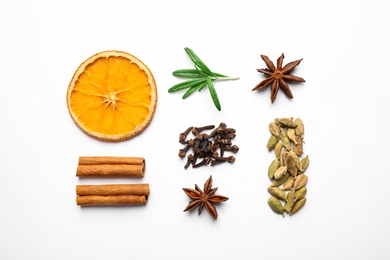 Different mulled wine ingredients on white background, flat lay