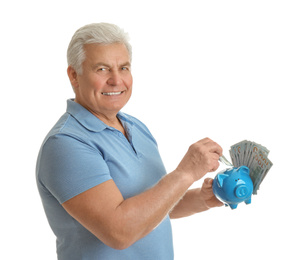 Photo of Happy senior man with cash money and piggybank on white background