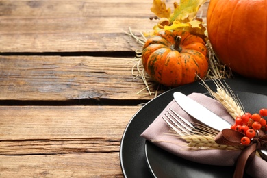 Festive table setting on wooden background, closeup with space for text. Thanksgiving Day celebration