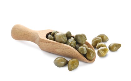 Wooden scoop and capers on white background