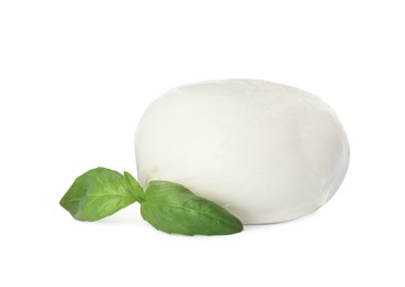 Delicious mozzarella cheese ball and basil on white background