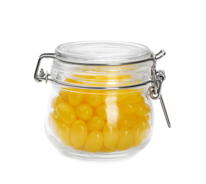 Tasty small lemon drops in glass jar isolated on white
