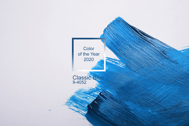 Paint strokes on white background, top view. Color of the year 2020 (Classic blue)