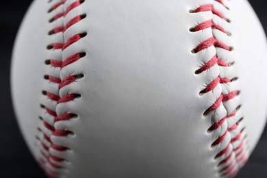 Photo of Baseball ball on black background, closeup. Sports game