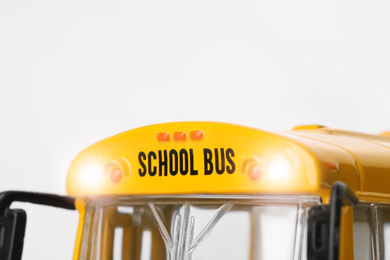 Photo of Yellow school bus on white background, closeup. Transport for students