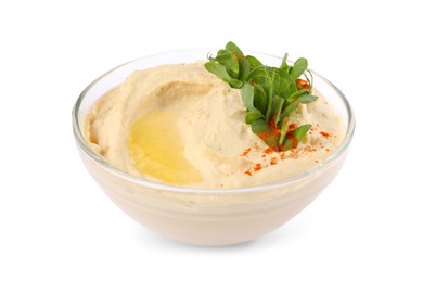 Photo of Bowl of tasty hummus with pea leaves and paprika isolated on white