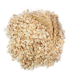 Photo of Pile of raw oatmeal and spikelets on white background, top view