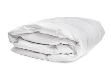 Folded soft blanket on white background. Household textile