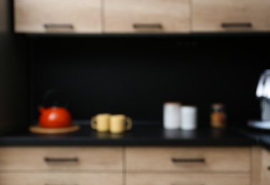 Blurred view of kitchen interior with modern furniture