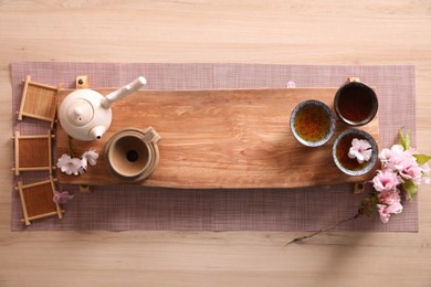 Beautiful set for traditional tea ceremony on wooden table, flat lay