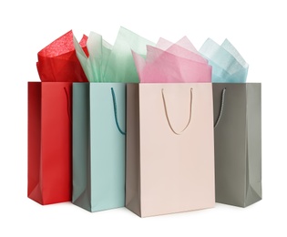 Gift bags with paper on white background