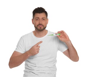 Photo of Man with rash holding thermometer on white background. Monkeypox virus diagnosis