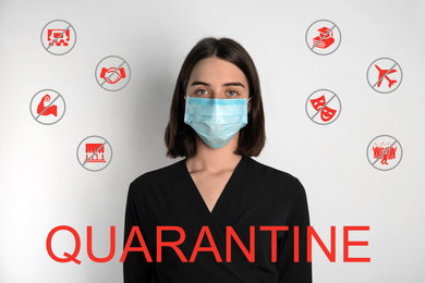 Woman with surgical mask against light background. Hold on quarantine rules during coronavirus outbreak