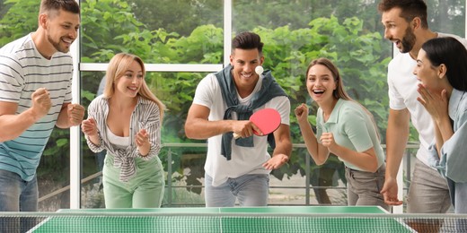 Happy friends playing ping pong together indoors. Banner design