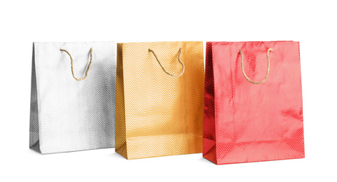 Color paper shopping bags isolated on white. Space for design