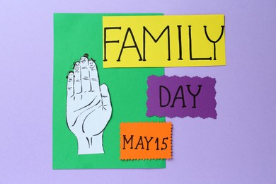 Happy Family Day. Cards with text and paper hand cutout on violet background, flat lay