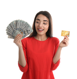 Young woman with money and credit card on white background