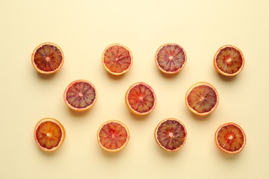 Many ripe sicilian oranges on beige background, flat lay