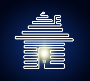 Creative image of house with light bulb on dark background. Energy efficiency, loan, property or business idea concepts