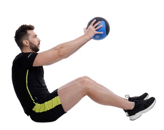 Athletic man doing exercise with medicine ball isolated on white
