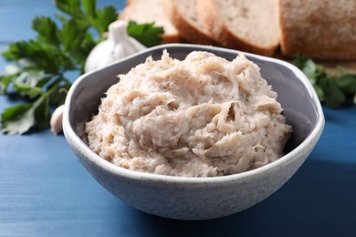 Photo of Delicious lard spread on blue wooden table