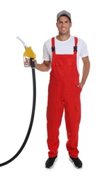 Gas station worker with fuel nozzle on white background