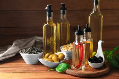 Different cooking oils and ingredients on wooden table