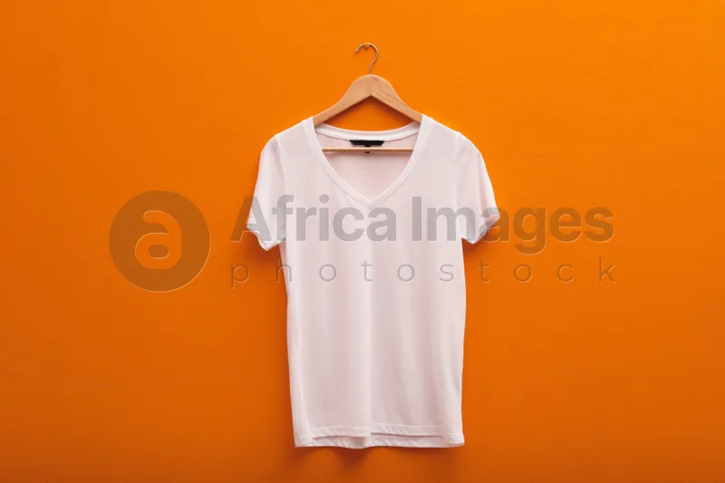 Download Hanger With Blank T Shirt On Color Background Mockup For Design Stock Photo By Africa Images