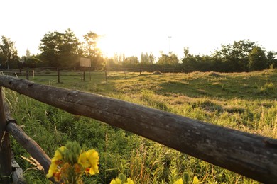 Photo of Picturesque view of countryside with wooden fence in morning