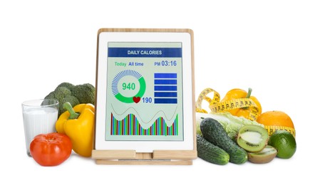 Photo of Tablet with weight loss calculator application, measuring tape and food products on white background