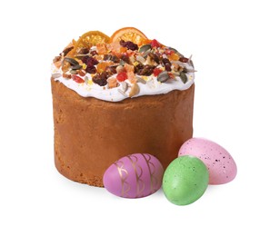 Photo of Traditional Easter cake with dried fruits and painted eggs isolated on white