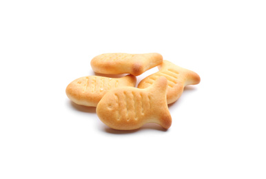 Delicious crispy goldfish crackers on white background
