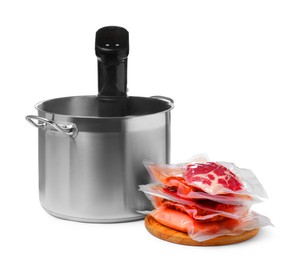 Thermal immersion circulator in pot and meat on white background. Vacuum packing for sous vide cooking