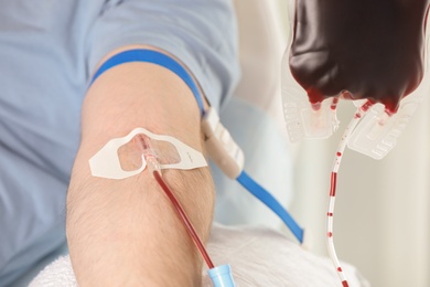 Man donating blood to save someone's life in hospital