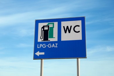 Photo of Traffic signs Petrol Station Equipped Only with Gas for Motor Vehicles and Public Toilet outdoors on sunny day