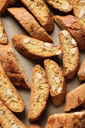 Photo of Traditional Italian almond biscuits (Cantucci) on parchment paper, top view