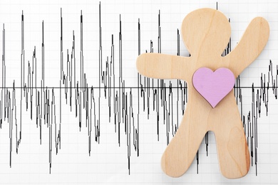 Human figure with heart on cardiogram, top view. Space for text