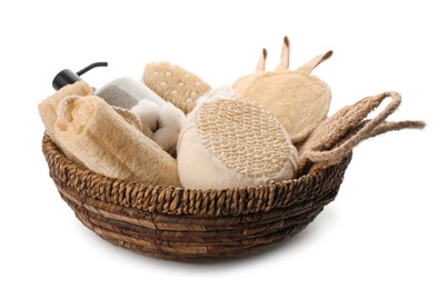 Set of toiletries with natural loofah sponges in wicker basket isolated on white