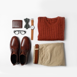 Stylish male autumn outfit and accessories on white background, flat lay. Trendy warm clothes