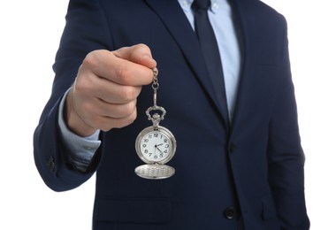 Businessman holding pocket watch on white background, closeup. Time management
